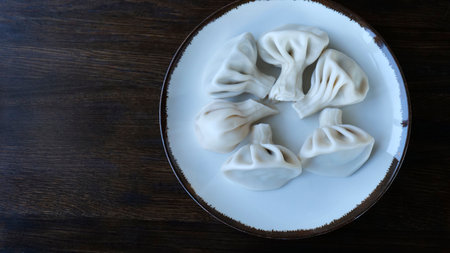 National Georgian cuisine. Khinkali with meat. Khinkali on a wooden board close-up.の写真素材