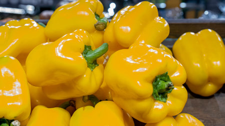 Yellow pepper on the counter in the supermarket. Pepper close-up background.