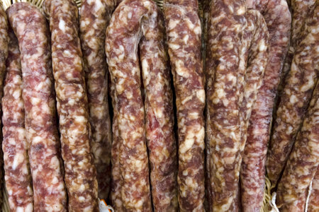 background from sausage. dry homemade sausage on the supermarket shelf.の写真素材
