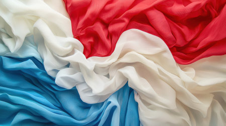 Vibrant layers of fabric in red, white, and blue create a captivating display. The soft textiles blend seamlessly, showcasing their delicate textures and colors.の素材