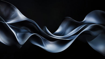 A long, curvy, black and silver wave. The image is abstract and has a futuristic feel to itの素材