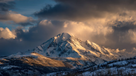 Snow covered peaks rise sharply against a colorful sky at dusk showcasing natures beauty and power.の素材