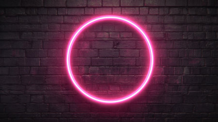 A vibrant pink neon circle illuminates a textured dark brick wall showcasing modern urban art.の素材