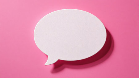 A blank speech bubble rests against a bright pink backdrop inviting endless creative expressions.の素材