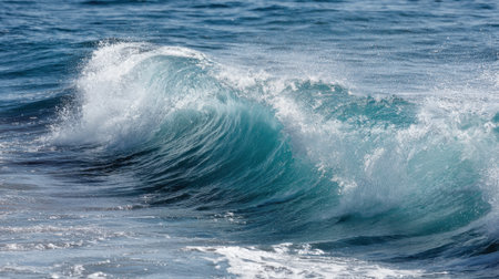 Clear blue ocean waves gently crash against the sandy beach during a sunny day creating a peaceful atmosphere for relaxation and nature appreciation.の素材