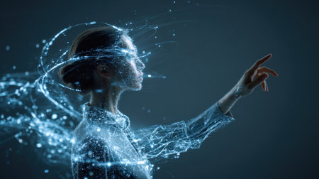 A woman reaches out as glowing lights swirl around her in an enchanting display of technology.の素材