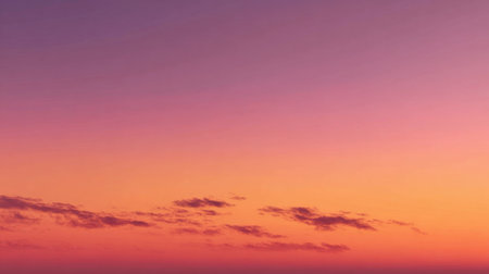 A breathtaking sunset unfolds casting brilliant colors across the sky with soft clouds drifting by.の素材