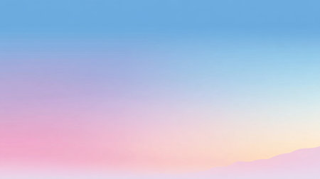 A stunning pastel sunrise brightens the sky illuminating the mountains with gentle colors.の素材