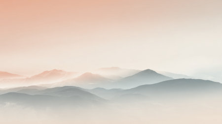 Layers of mountains stretch across the horizon, bathed in gentle hues of orange and pink during early morning. The scene evokes a feeling of tranquility and peace.の素材
