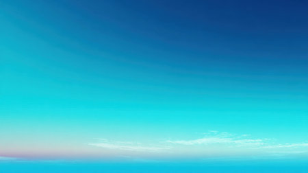 A rich blue sky transitions to lighter shades near the horizon at sunset. Wispy clouds add texture, enhancing the tranquil scene as dusk approaches over the landscape.の素材