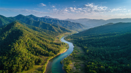 Majestic view of a river curving through vibrant green hills and valleys under a sunny sky.の素材