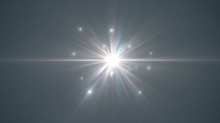 A stunning starburst of light radiates gracefully against a calm evening sky creating a serene moment.の素材