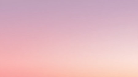 Soft pastel colors stretch across the sky as the sun sets creating a serene evening scene.の素材