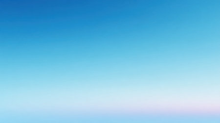 A tranquil scene features a gradual blend of blue hues and soft pastel colors as the sun sets at dusk.の素材