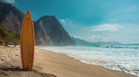 A bright sunny day unfolds at a serene beach where surfers gather. The soft sand contrasts with towering cliffs as gentle waves roll in perfect for surfing and relaxation.の素材