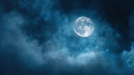 A bright full moon illuminates the night sky surrounded by swirling clouds. The scene creates a mystical atmosphere inviting wonder and reflection.の素材