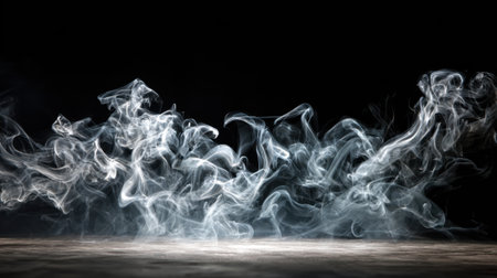 Delicate wisps of smoke rise and swirl in intricate patterns against a black backdrop creating an enchanting and mysterious scene filled with fluid movement.の素材