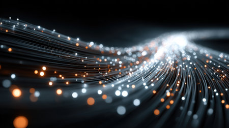 Colorful strands of light extend gracefully, illuminating the darkness with a dynamic blend of white and orange tones, simulating movement and energy in a digital space.の素材