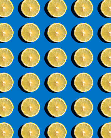 Pattern of lemons on a blue background. Copy space.の写真素材
