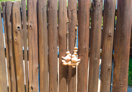 wooden fence and birdsの写真素材
