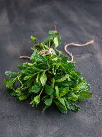 Fresh mint leaves on stone table.の写真素材
