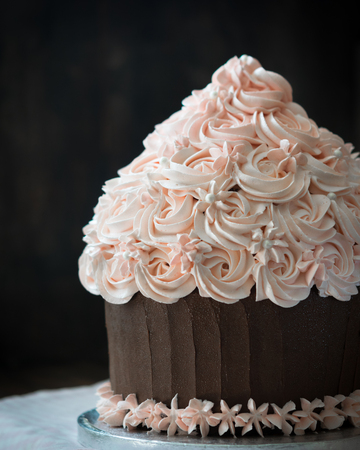 Beautiful cupcake cake with rose cream decoration.の写真素材