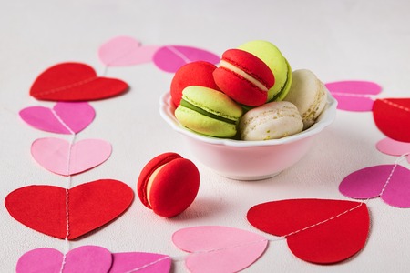 Valentines day composition background with colorful macarons. Valentine's day concept. Horizontal. Selective focus. Trendy color background.の写真素材