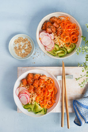 Noodles with vegetables, marinated salmon Sashimi, Carrot noodles, cucumber, radish soy sauce,...