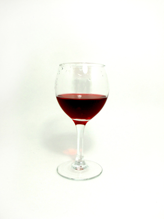 Glass of red wine on the white backgroundの写真素材