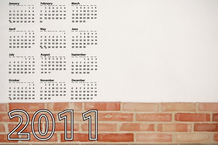 2011 calendar with brick and white wallの写真素材