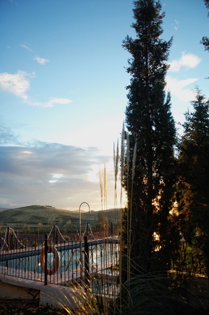 Swimming pool at sunset, autumn seasonの写真素材