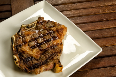 Grilled sirloin beef steak on white plateの写真素材