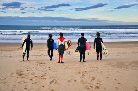 Young surfers on the beach at Somo Surfer center, Cantabria, Spainのeditorial素材