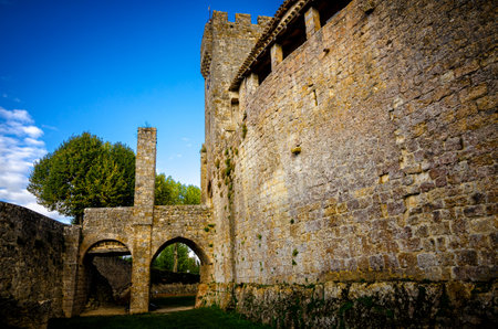 Larressingle, one of the most beautiful and small fortified villages in France with walls, towers, moats, entrance bridge, castle, fortified church and medieval houses attached to the wallsのeditorial素材