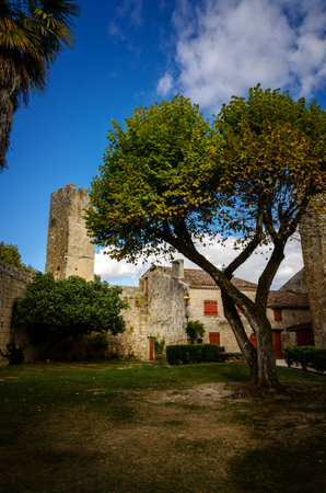 Larressingle, one of the most beautiful and small fortified villages in France with walls, towers, moats, entrance bridge, castle, fortified church and medieval houses attached to the wallsのeditorial素材