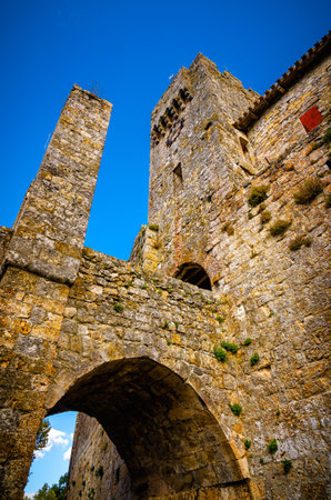 Larressingle, one of the most beautiful and small fortified villages in France with walls, towers, moats, entrance bridge, castle, fortified church and medieval houses attached to the wallsのeditorial素材
