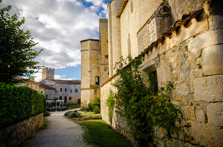 Larressingle, one of the most beautiful and small fortified villages in France with walls, towers, moats, entrance bridge, castle, fortified church and medieval houses attached to the wallsのeditorial素材