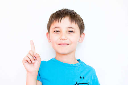 the boy raised his index fingerの写真素材