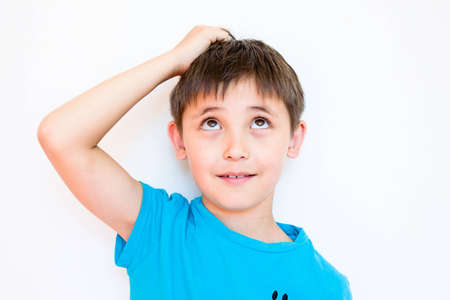 boy thinking about different thingsの写真素材