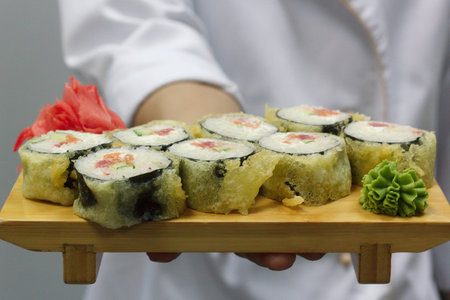 chef holding hot rollsの写真素材