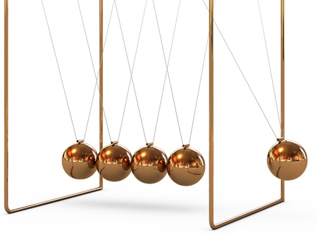 Gold metal pendulum balls balancing from strings in Newtonの写真素材