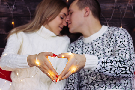 new year light heart at couple hands.の写真素材