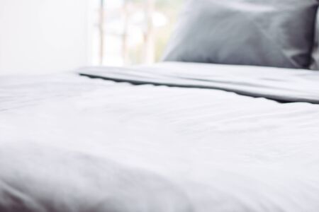 grey clean perfect bed, hotel room, towel, linens, backgroundの写真素材