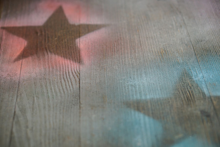 Wooden surface with painted stars silhouettes Background designの写真素材