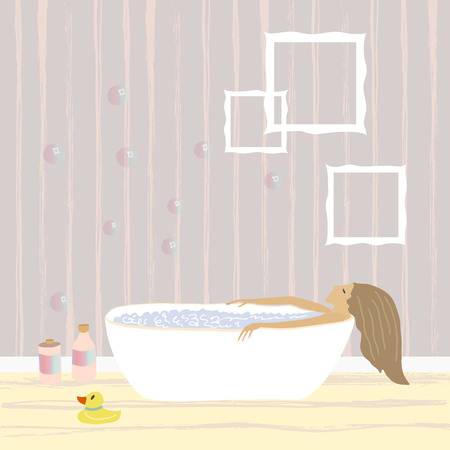 Woman relaxing in the free standing bath with bubble foam . Bathroom interiorの写真素材