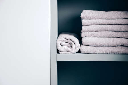 Stack of towels in the the shelfの写真素材
