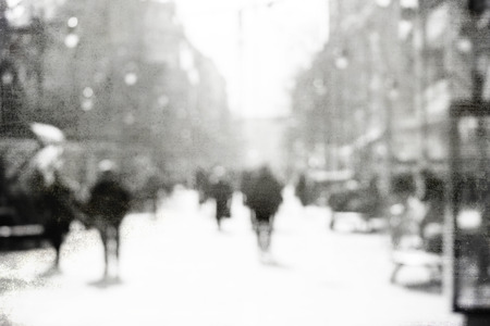 High key blurred image of people walking in the street.の写真素材