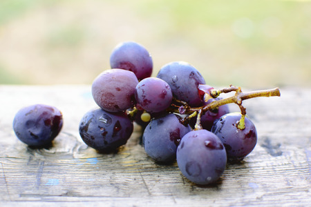 Red grape on wooden table, closeupの写真素材