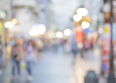 blur abstract people background, unrecognizable silhouettes of people walking on a streetの写真素材