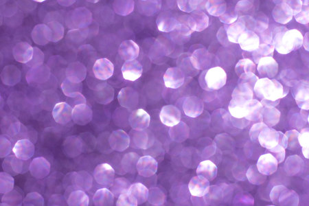 Christmas background. Festive abstract holidaysbackground with bokeh defocused lights and stars. Purple, lilac, violet color, tonedの写真素材